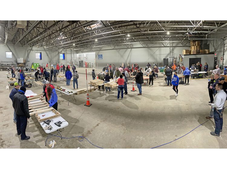 The Flossmoor Public Works garage is buzzing with activity on Saturday, Jan. 11, for a Sleep in Heavenly Peace bed build, among the village’s Martin Luther King Jr. Day of Service activities. (Bill Jones/H-F Chronicle)