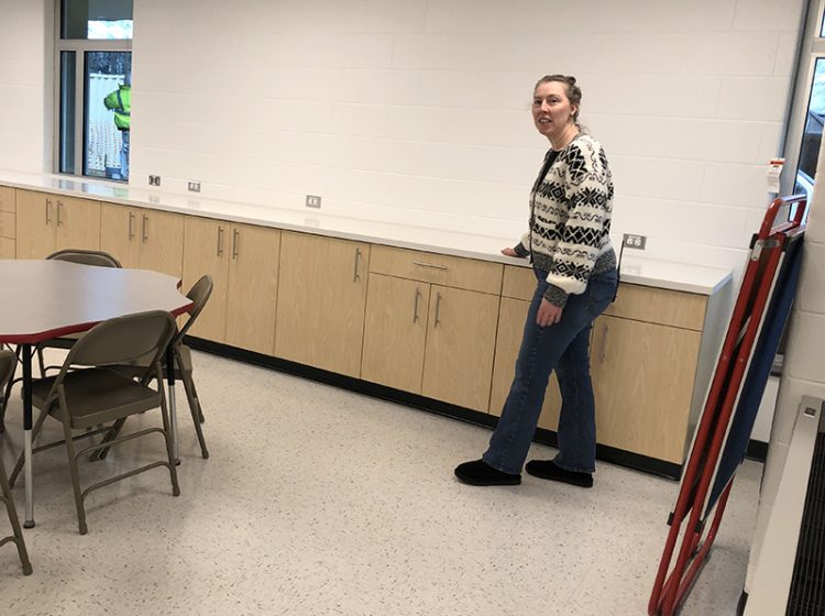 Churchill School principal Sara Schnoor points out the storage space in one of the new third grade classrooms. Storage is crucial for both student and teacher needs. (Marilyn Thomas/H-F Chronicle)