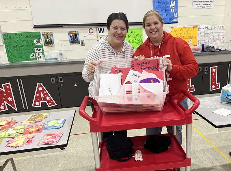 District English Language Learners coordinator Meagan Franker, left, and Serena Hills Principal Elizabeth Reich show the many Valentine's Day cards that were made by the end of the morning. (Nick Ulanowski/H-F Chronicle)