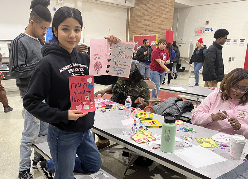 Sofia Leal, H-F High School student and National Honors Society member, shows off two of the Valentine's Day cards she made at the Serena Hills MLK Day of Service project. (Nick Ulanowski/H-F Chronicle)