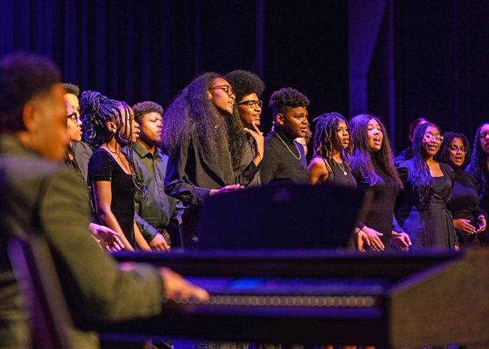 The Inspirational Voices choir performs gospel music to a live backing band. (Andrew Burke-Stevenson/H-F Chronicle)