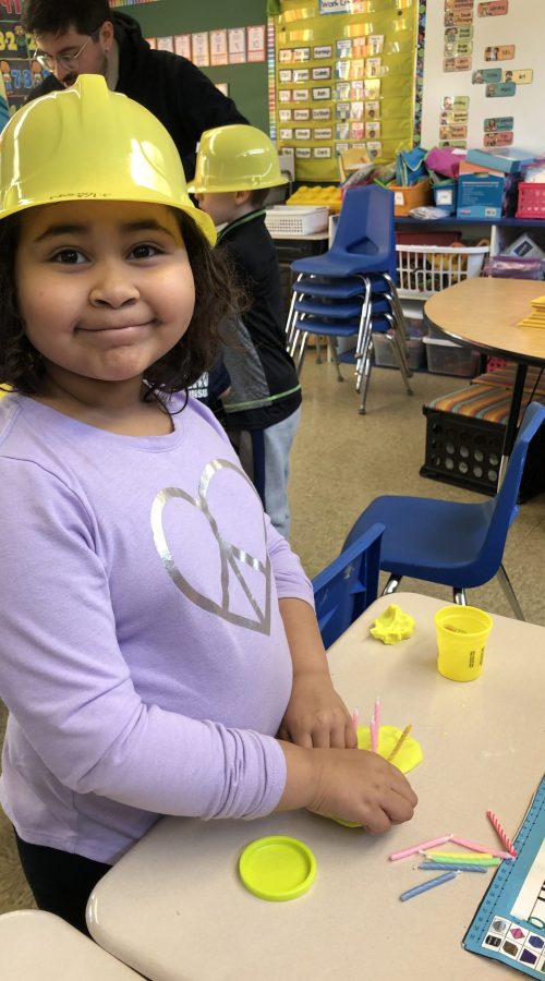 Maggie Drake, a first grader at Willow School, was busy creating a birthday cake with candles. Students were instructed to make as many cakes as they could to accommodate 100 candles to mark 100 days of school. (Marilyn Thomas/H-F Chronicle)