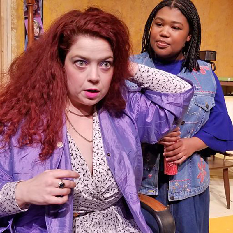Salon owner Truvvy, seated, played by Betty Wiggle of Homewood, discusses a hairstyle with her apprentice, Annelle, played by Laila London of Flossmoor, in the Drama Group production of "Steel Magnolias." (Provided photo)
