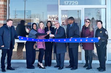 European Wax Center District Manager Ally Szakacs (left holding scissors), Manager Latoya Cosey (middle-holding scissors) and Mayor Rich Hofeld (right of Latoya) cut the ribbon on Monday, Feb. 13, to officially open the shop at 17729 S. Halsted St. in Homewood. (Nuha Abdessalam/H-F Chronicle)
