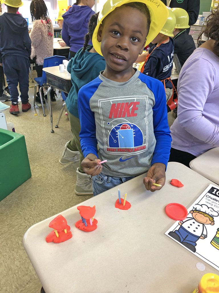 Dreux-Alexander Hilton had his construction hat on as he built cakes with Play-Doh that got special treatment with birthday candles. First graders were constructing projects that counted to 100. (Marilyn Thomas/H-F Chronicle)