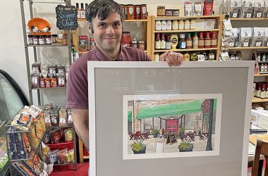 Nico Martinez with a piece of artwork he made that was commissioned by Dunning’s Market in 2019. (Provided Photo)