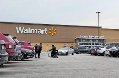 Customers and cars negotiate the parking lot at Homewood's Walmart on Halsted Street Wednesday afternoon. Walmart officials announced the store will be closing March 10. (Eric Crump/H-F Chronicle)