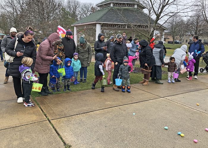 The 3 and younger Easter egg hunters and their parents line up waiting for the start. This year children were divided by age group. (Marilyn Thomas/H-F Chronicle)