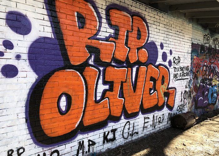 Skaters created a memorial to a friend. The graffiti is acceptable on the back wall of the H-F Park District garage on Harwood Avenue. (Marilyn Thomas/H-F Chronicle)
