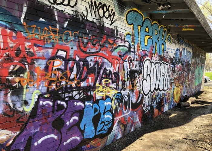 Taggers have decorated the back wall of the H-F Park District garage for years, and the park district is OK with graffiti at this site. (Marilyn Thomas/H-F Chronicle)