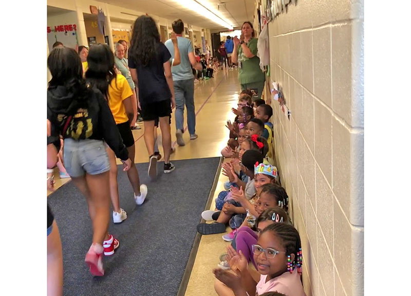Willow students applaud James Hart School eighth graders as they parade through the halls on a visit to their old stomping grounds. (Marilyn Thomas/H-F Chronicle)