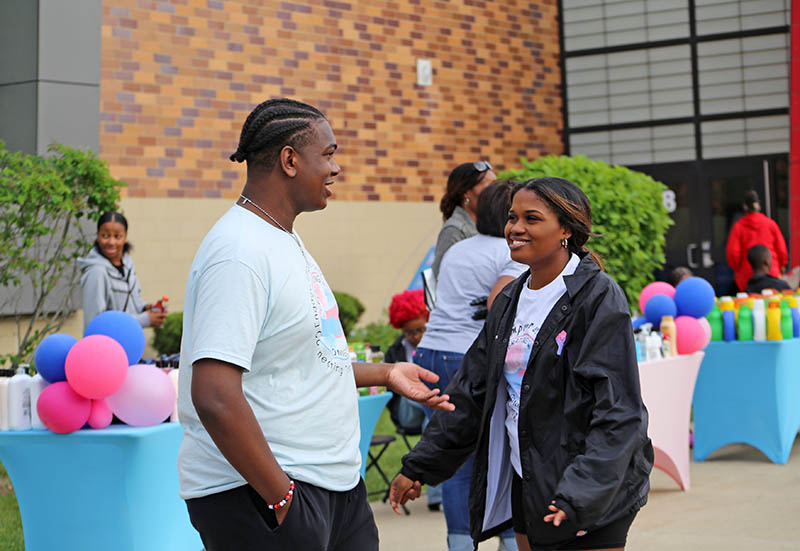 Regional Teen Foundation Chair Carlos Dillard Jr., left, at the Jack and Jill of America South Suburban Chapter toiletries drive at Homewood-Flossmoor High School on May 13. The collected items will benefit homeless teens in the South Suburbs. (Annelise Latham/H-F Chronicle)