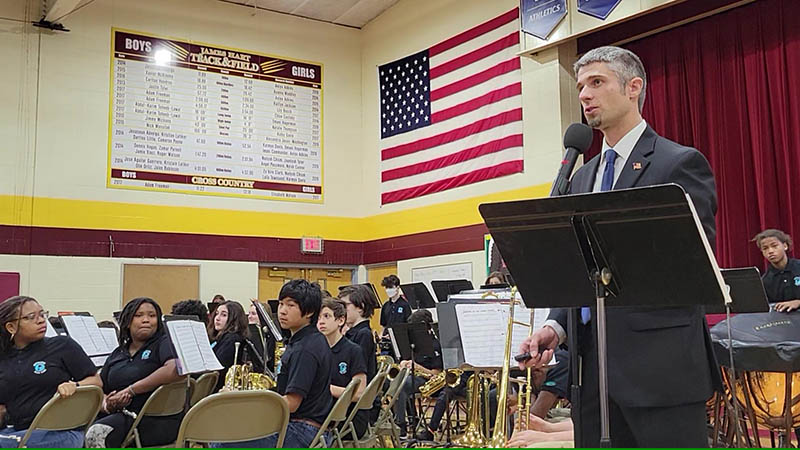 Matt Johnson introduces the James Hart Orchestra during the 2022 Veterans Day assembly. He was selected a 2023 Outstanding Music Educator and will receive the award in June. (Chronicle file photo)