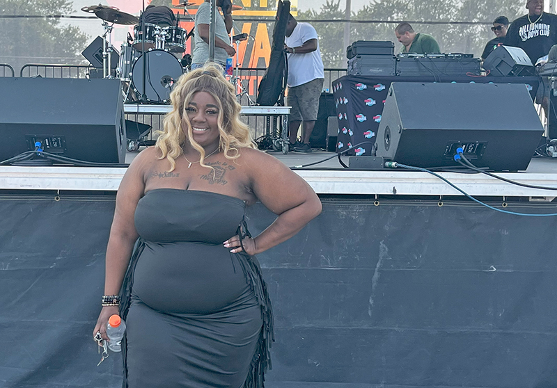 China Stewart, lead singer for Chicken N Waffles band in front of the stage at HF Juneteenth Festival. (Nuha Abdessalam/H-F Chronicle)
