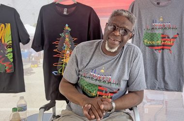 Artist Keith David Conner talking about his work at the Juneteenth celebration. (Nick Ulanowski/H-F Chronicle)
