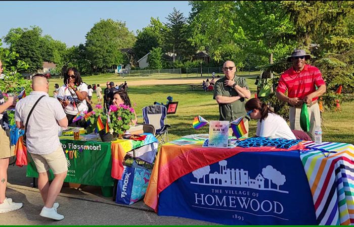 The villages of Homewood and Flossmoor have side-by-side tables at the Starry Nights/Pride Night event. The villages along with the H-F Park District sponsored the event. (Eric Crump/H-F Chronicle)