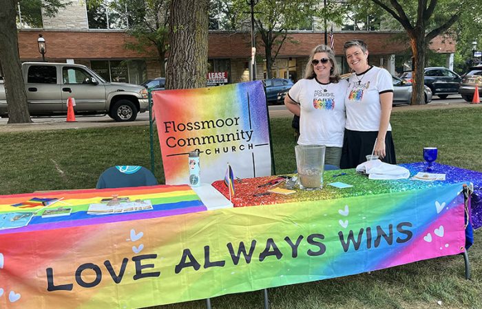 Brooke King-LaBreck, left, and Rev. Julie Van Til at the Flossmoor Community Church table at Starry Nights/Pride Night on June 9. (Nick Ulanowski/H-F Chronicle)