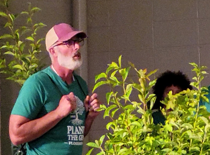 Flossmoor Green Commission Chair Tristan Shaw answers a judge's questions about the need for ambitious tree-planting projects like the village's Plant the Gem event. (Eric Crump/H-F Chronicle)