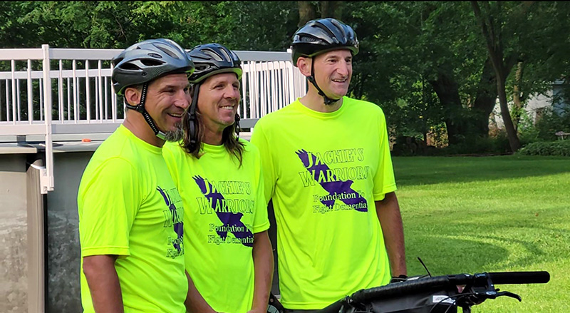 Cyclists, from left, Greg Castady, Chris Dedo and Dana Noble post for photos before leaving on a 130-mile fundraising bike ride Thursday, Aug. 10. (Eric Crump/H-F Chronicle)