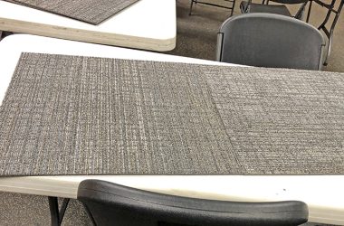 The new shade of gray carpeting at Homewood Public Library will replace the current brown carpeting. Installation begins Aug. 28. (Marilyn Thomas/H-F Chronicle)