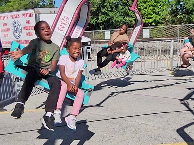 The Adeyemo kids from Flossmoor enjoy a ride during Flossmoor Fest. (Eric Crump/H-F Chronicle)