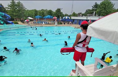 A Lions Pool lifeguard watches over summer camp swimmers in 2023. (Chronicle file photo)