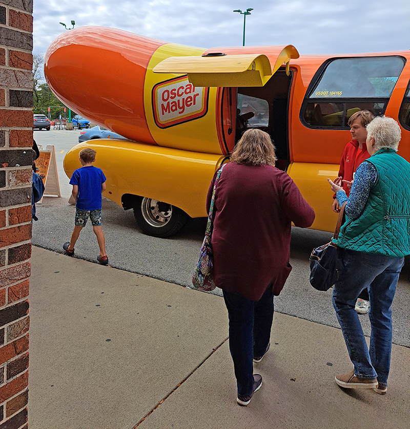 Walt's Food Center patrons check out the Wienermobile on Friday, Oct. 6. (Amy Crump/H-F Chronicle)