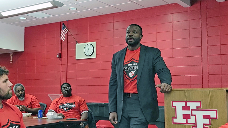 H-F High Principal Clinton Alexander addresses a room full of dads during the second annual Dad Squad on Oct. 30.