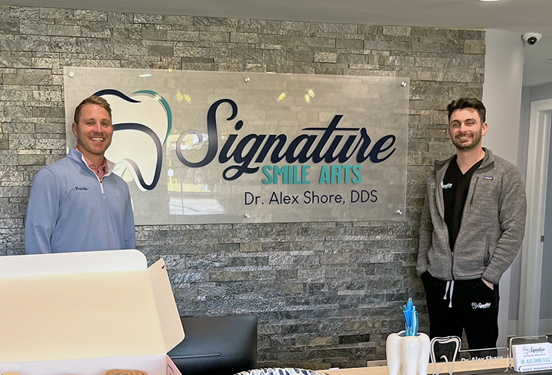Dr. Alex Shore, right, with Tom Muck, a representative from Provide, the company that helped with the renovations at Signature Smile Arts. (Nick Ulanowski/H-F Chronicle)
