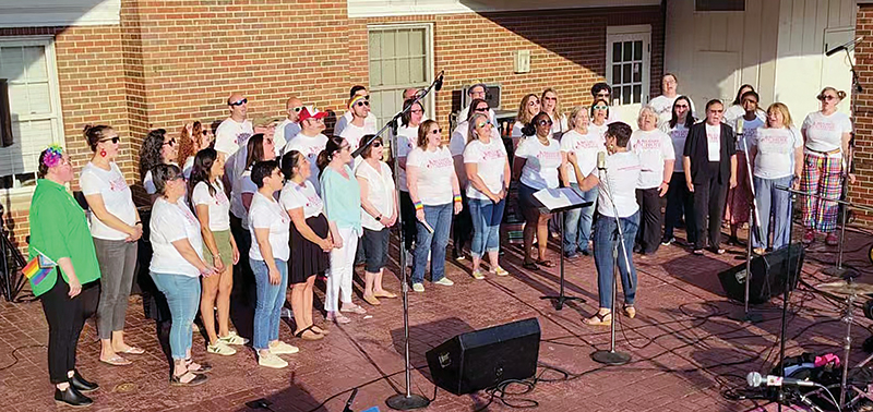 The Bel Canto Community Choir performs during the Starry Night/Pride Fest event in Irwin Park.