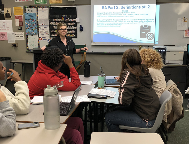 Attorney Elise Meintanis helps H-F debaters prepare for an upcoming debate where they will argue the finer points of Section 230 of the Communications Decency Act. Debaters put in hours of preparation to familiarize themselves with national and international issues.