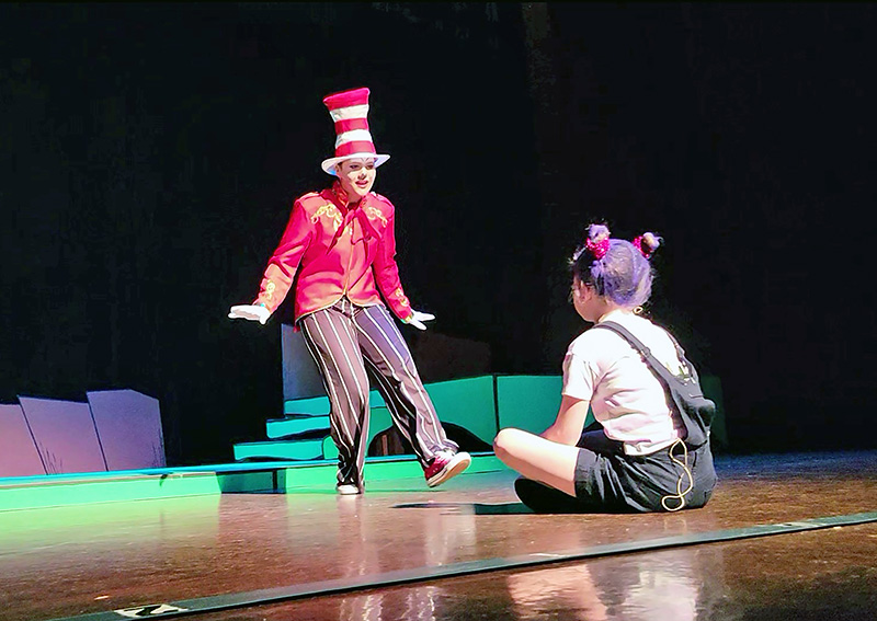 Mia Cavalieri as the Cat in the Hat with Erin Graves perform on the Freedom Hall stage during the Spotlight Performance Academy’s production of “Suessical Jr.” (Eric Crump photos/H-F Chronicle)