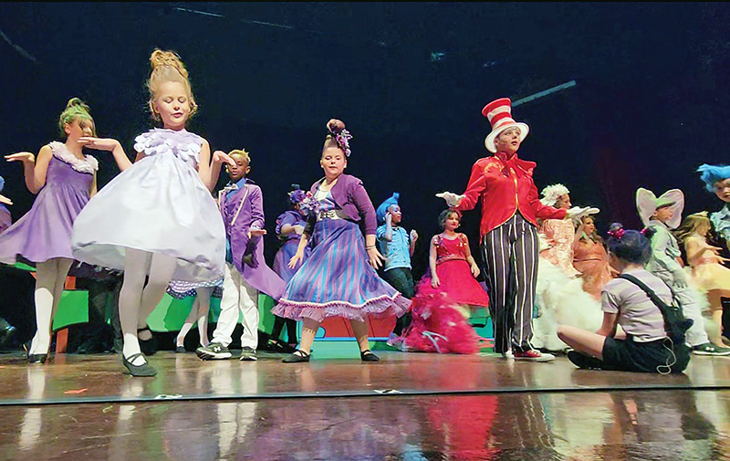 Dancers perform on the Freedom Hall stage during the Spotlight Performance Academy production of "Suessical Jr."
