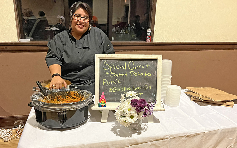 Karla M. Quezada, private and corporate chef and Center for Food Equity in Medicine board member, serves spiced carrot and sweet potato puree. (Nick Ulanowski/H-F Chronicle)