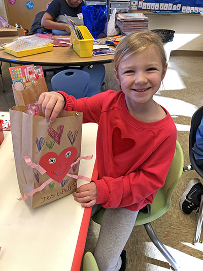 Josephine Kneeland, a kindergartener at Willow School, decorated her treat bag for Valentine's Day. (Marilyn Thomas/H-F Chronicle)