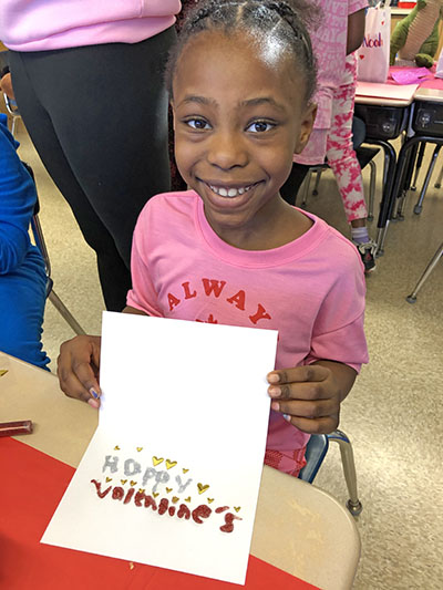 Malia Butler was sending a message of love to her mom as part of her second grade class project for Valentine's Day. (Marilyn Thomas/H-F Chronicle)
