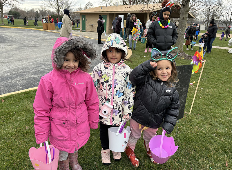 Anxiously waiting for the Easter egg hunt to begin are, from left, Soleil and Mia Gonzalez, 5, and their sister Jessica, 3. (Marilyn Thomas/H-F Chronicle)