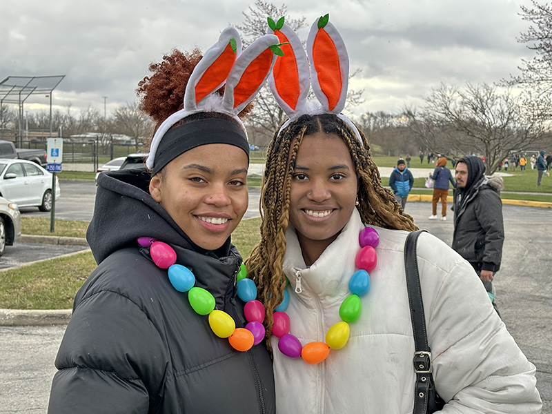 Homewood-Flossmoor High School seniors Saada Marvel, left, and Sanaa Henry were volunteers at the H-F Park District egg hunt. They are members of the H-F National Honor Society. (Marilyn Thomas/H-F Chronicle)