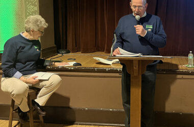 Flossmoor Veterans Memorial president Paul Braun reads trivia questions at the organization's annual fundraiser Friday, March 15. Secretary-treasurer Kris Condon sits nearby. (Nick Ulanowski/H-F Chronicle)