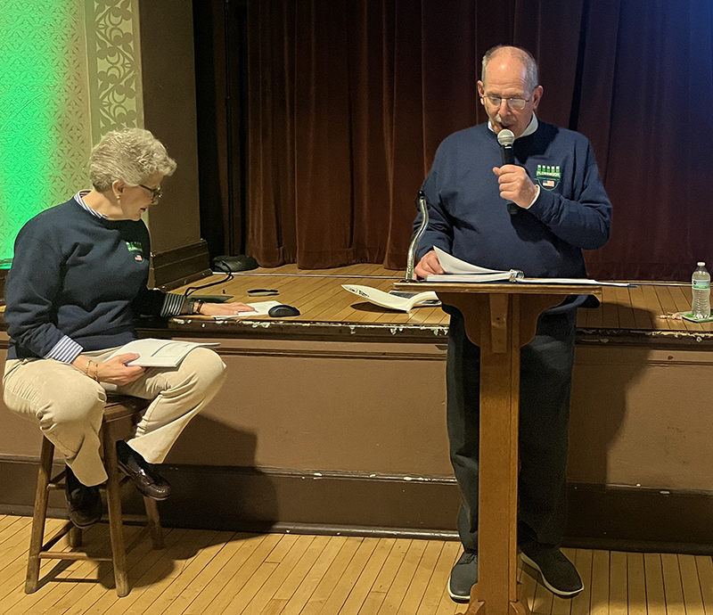 Flossmoor Veterans Memorial president Paul Braun reads trivia questions at the organization's annual fundraiser Friday, March 15. Secretary-treasurer Kris Condon sits nearby. (Nick Ulanowski/H-F Chronicle)