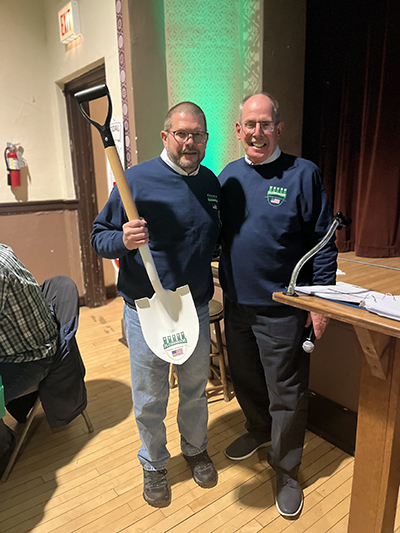 Flossmoor Trustee Brian Driscoll, left, shows off FVM groundbreaking shovel he won at auction with FVM president Paul Braun. (Nick Ulanowski/H-F Chronicle)
