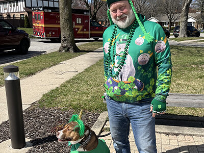 Joe Nordman with his dog Otis ready to march in Flossmoor's Saint Patrick's Day parade. (Nick Ulanowski/H-F Chronicle)