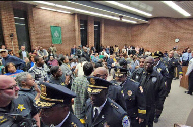 Area law enforcement officers who attended the Flossmoor board meeting Monday, March 4, file out of the room following public comments. (Eric Crump/H-F Chronicle)