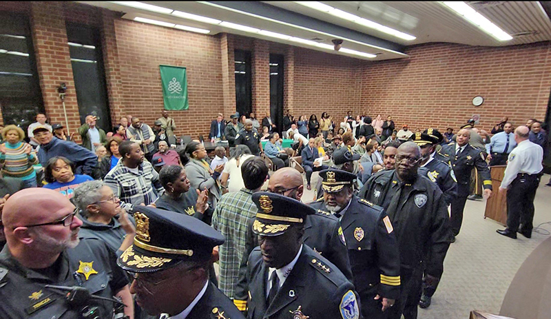 Area law enforcement officers who attended the Flossmoor board meeting Monday, March 4, file out of the room following public comments. (Eric Crump/H-F Chronicle)