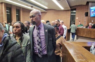 Flossmoor Police Chief Jerel Jones leaves the board room following the public comment portion of the Board of Trustees meeting. (Eric Crump/H-F Chronicle)