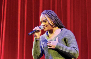 H-F High student Jazmin Rhodes channels actor Sheryl Lee Ralph during a monologue on self-confidence during Pursuing the Dream on Jan. 24. (Eric Crump/H-F Chronicle)