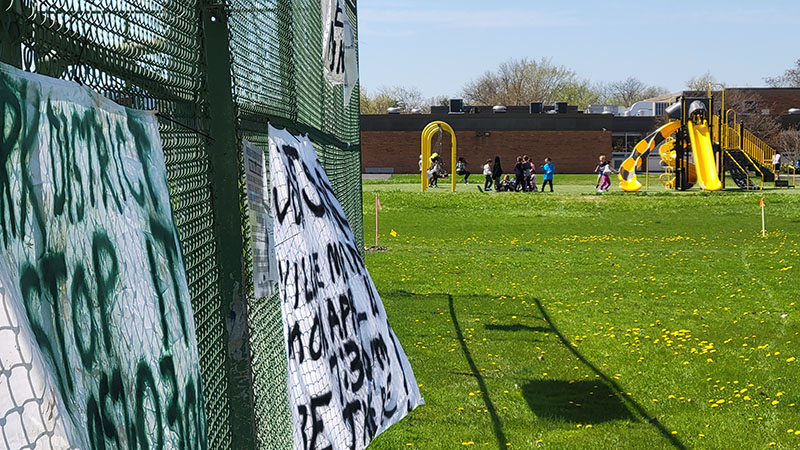 Children play outside Heather Hill School on Monday, April 8. Some parents oppose building a storm water detention basin near the school. (Eric Crump/H-F Chronicle)