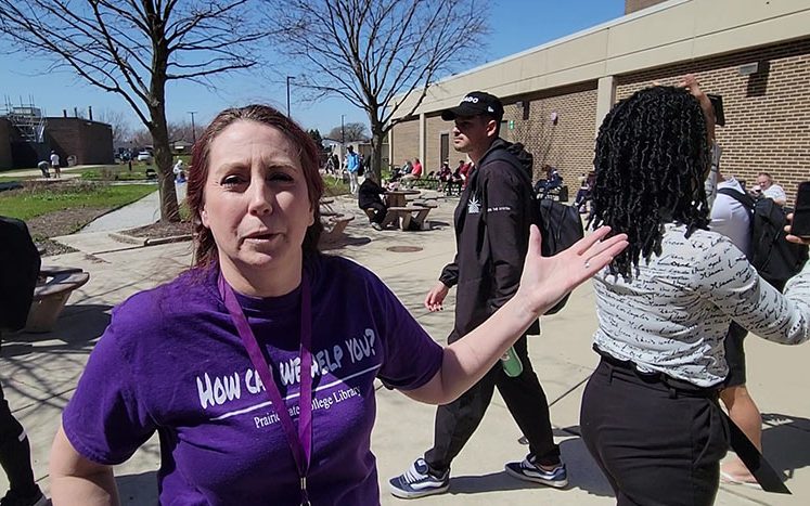 Dawn Sterning, PSC library services manager, explains the various eclipse activities offered on April 8. (Eric Crump/H-F Chronicle)