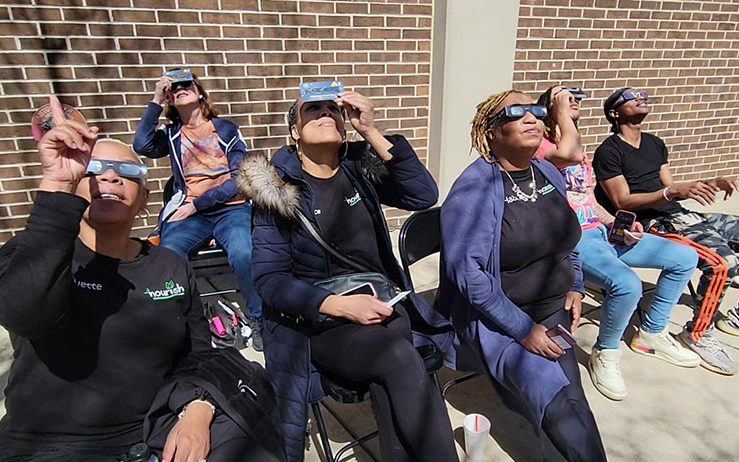 From left, eclipse viewers Yvette Miller, Candice Seals, Hazel McCoy, Darryl Williams and Andre Harris II. (Eric Crump/H-F Chronicle)