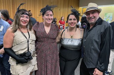 Head of Youth Services Angela Messaglia, second from left, welcomed family members from left, Susan Messaglia, Christina Messaglia Fulton, and John Messaglia, to the Homewood Public Library's 100th gala. (Marilyn Thomas/H-F Chronicle)